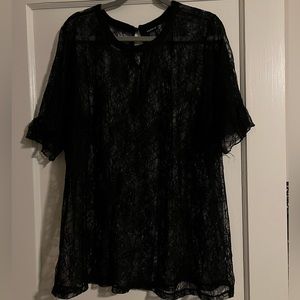 Sexy sheer lace blouse. Single ruffle at sleeve hem.